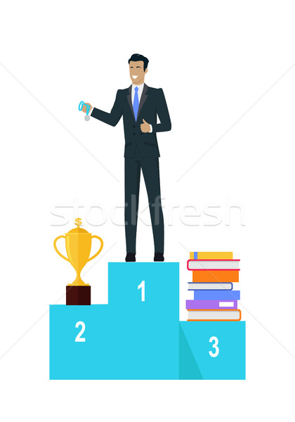 Businessman on Pedestal of Winners Stock photo © robuart