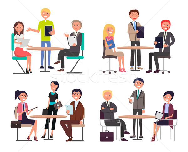 Men and Women Around Tables Discuss Work Issues Stock photo © robuart