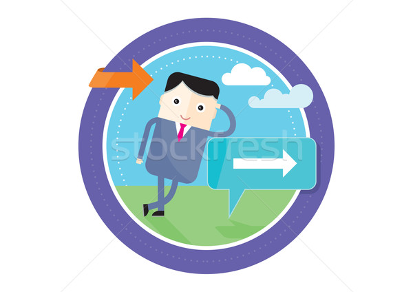 Stock photo: Businessman standing at a crossroad. A signpost points at multiple directions