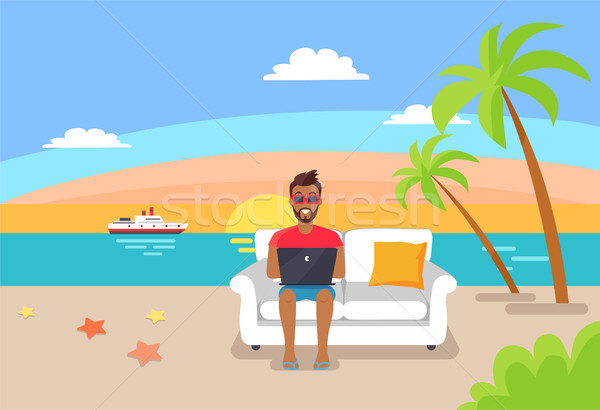 Freelancer Working on Laptop Sitting on Cosy Sofa Stock photo © robuart