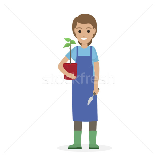 Happy Gardener with Plant in Pot and Garden Shovel Stock photo © robuart
