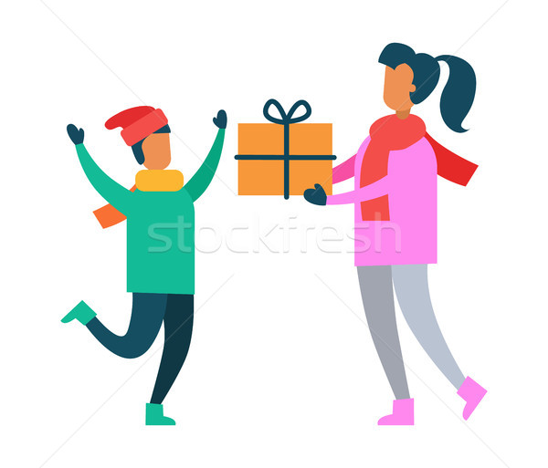 Mother Greets Son with Present Packed in Gift Box Stock photo © robuart