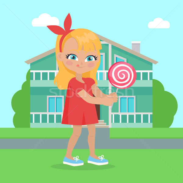 Girl Holds Lollipop in Hands in Front of Houses Stock photo © robuart