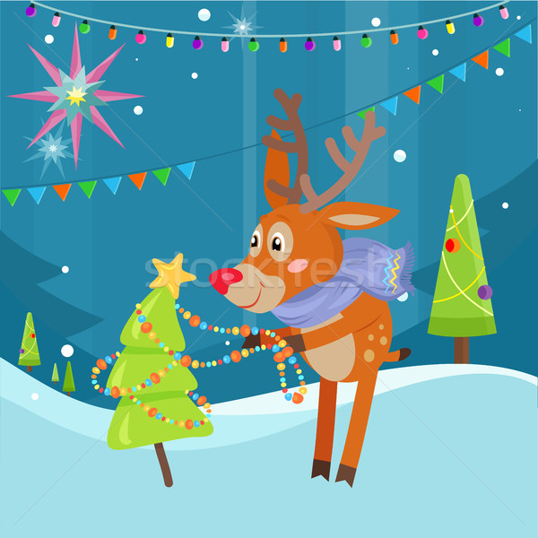 Stock photo: Deer in Scarf Decorating Christmas Tree at Snow
