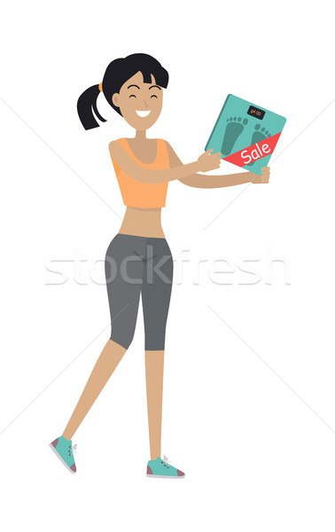 Woman Holds Bathroom Scale with Price Reducing Tag Stock photo © robuart