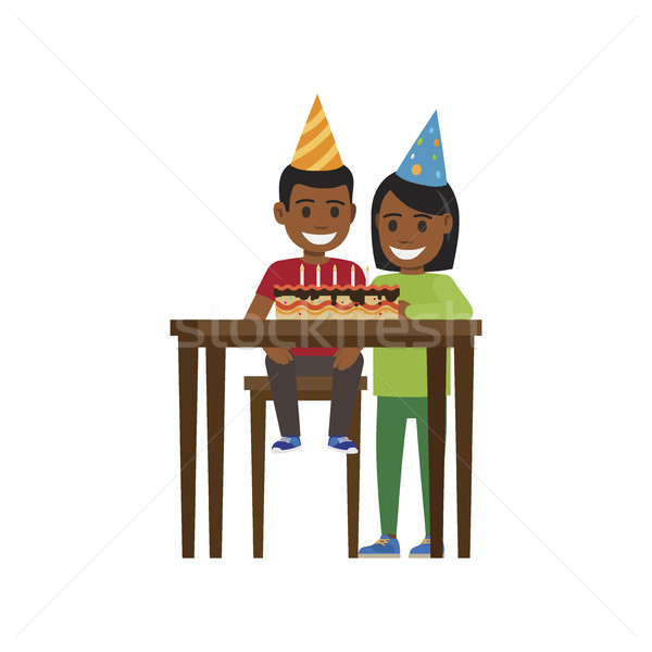 Boy and Girl at Table with Happy Birthday Cake Stock photo © robuart