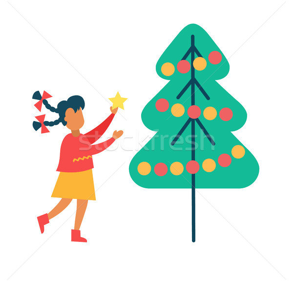 Girl Decorates New Year Tree Putting Star on Top Stock photo © robuart