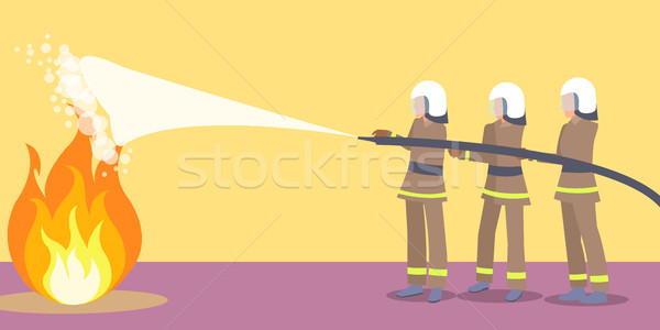 Firefighters in Helmets Trying to Extinguish Fire Stock photo © robuart