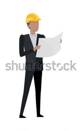 Man in Black Suit and Yellow Helmet. Blueprint Stock photo © robuart