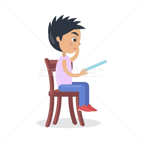 Profil băiat şedinţei scaun citit basm Imagine de stoc © robuart