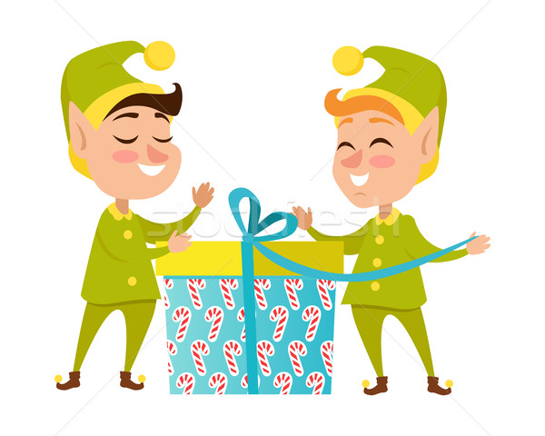Two Happy Elves with Present on White Background Stock photo © robuart