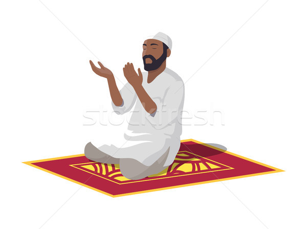 Arab Does Traditional Religious Ritual on Carpet Stock photo © robuart