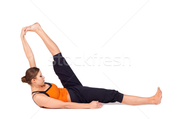 Woman Practicing Reclining Big Toe Yoga Pose Stock photo © rognar