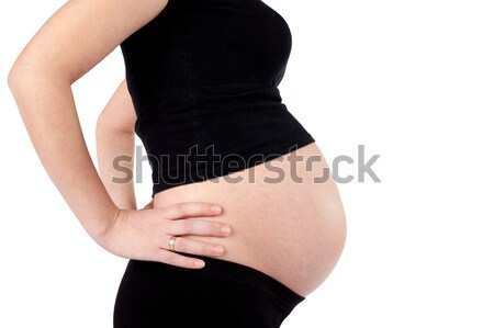 [[stock_photo]]: Femme · enceinte · mains · hanches · neuf · mois · isolé