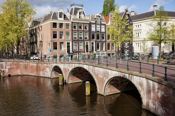 Bridge over Canal and Houses in Amsterdam Stock photo © rognar