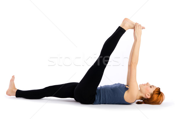 Woman doing Stretching Yoga Exercise Stock photo © rognar