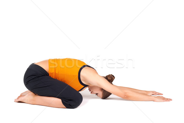 Woman Doing Extended Child Pose Yoga Asana Stock photo © rognar
