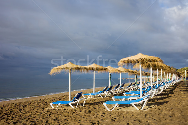 Sun Loungers at Marbella Beach Stock photo © rognar