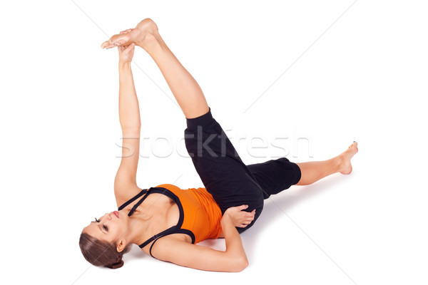 Woman Practicing Reclining Big Toe Yoga Pose Stock photo © rognar