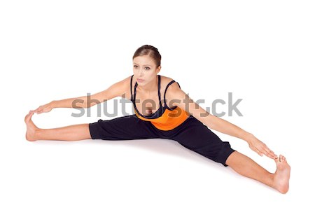 Woman Practicing Twist Pose Yoga Exercise Stock photo © rognar