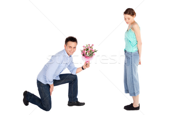 Casual Man Offering Flowers to Woman Stock photo © rognar