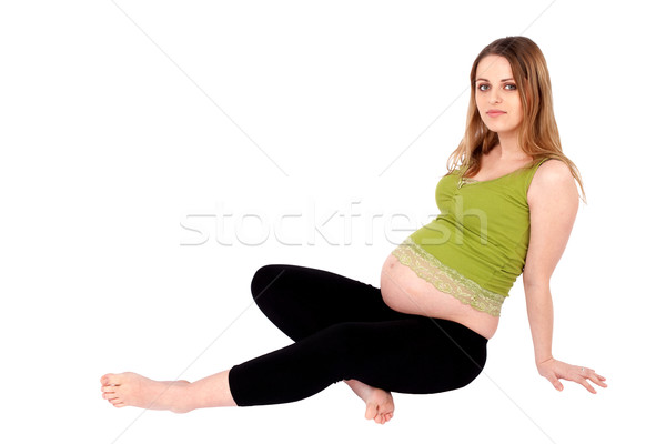 Foto stock: Mujer · embarazada · sesión · suelo · jóvenes · mirando · cámara