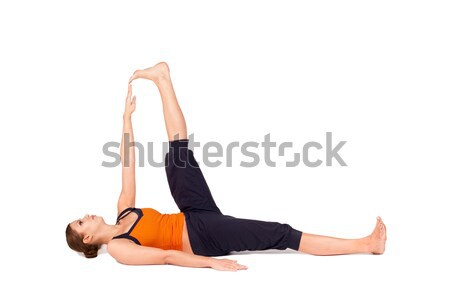 Woman Practicing Reclining Big Toe Yoga Pose Stock photo © rognar