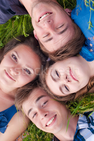 Gelukkig vier vrienden gras groen gras Stockfoto © rosipro
