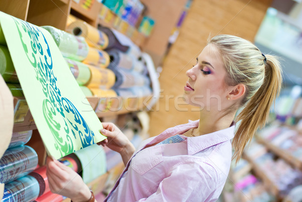 Woman with rolls of wallpaper Stock photo © rosipro