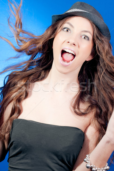 Happy young woman with flying hair  Stock photo © rosipro