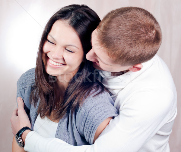 Happy young couple embracing and laughing Stock photo © rosipro