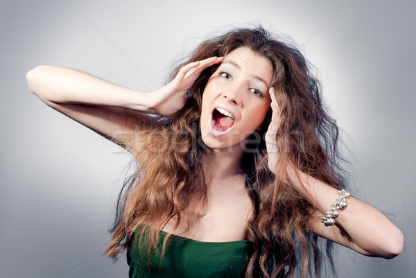 Belo mulher jovem desgrenhado penteado gritando Foto stock © rosipro