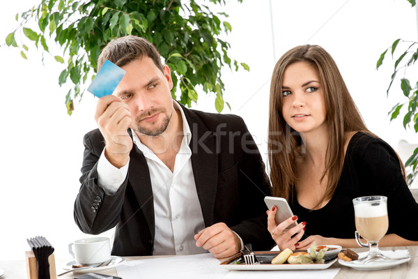 Young couple at the restaurant Stock photo © RossHelen