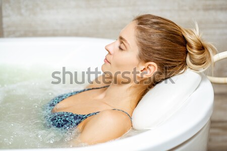 Nő fiatal pozitív lábak fürdőkád hab Stock fotó © RossHelen