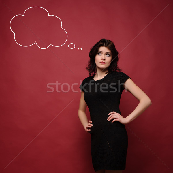 Atraente mulher jovem pensando estúdio vermelho menina Foto stock © rozbyshaka