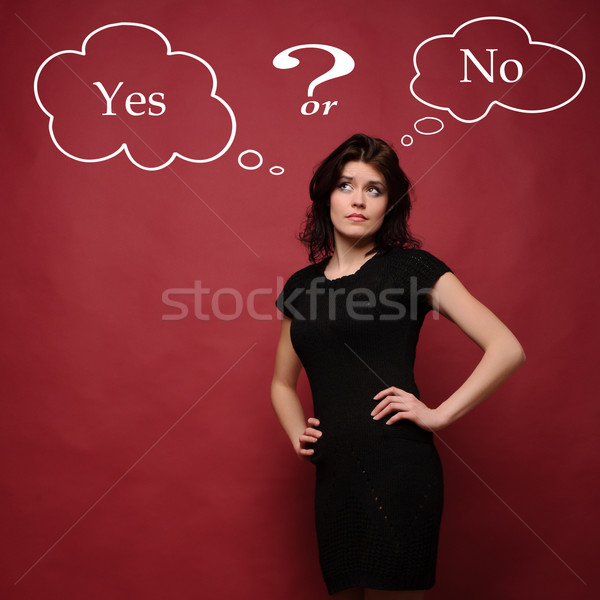 attractive young woman thinking yes or no Stock photo © rozbyshaka