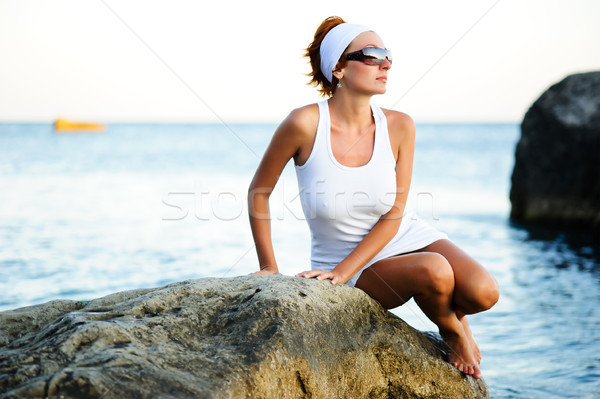 woman sitting on a stone in the sea Stock photo © rozbyshaka