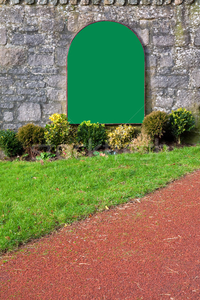 Blank green sign on an old stone wall Stock photo © RTimages