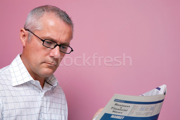 Businessman reading the financial newspaper Stock photo © RTimages