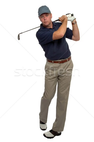 Jucător de golf albastru cămaşă fier shot leagăn Imagine de stoc © RTimages
