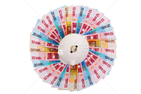 Piggy bank on circle of Euro banknotes Stock photo © RTimages