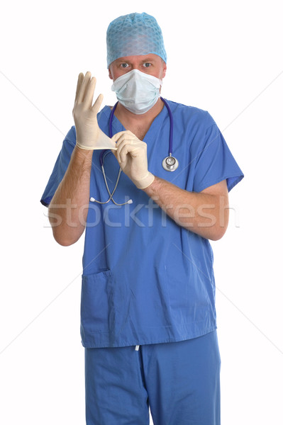 Surgeon putting gloves on. Stock photo © RTimages