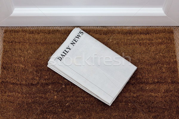 Newspaper lying on a doormat Stock photo © RTimages