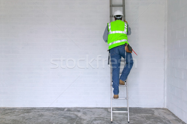 Workman climbing a ladder Stock photo © RTimages
