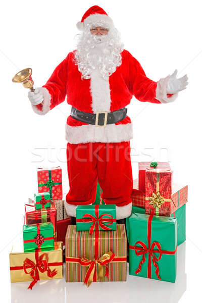 Father Christmas surrounded by presents, isolated on white. Stock photo © RTimages