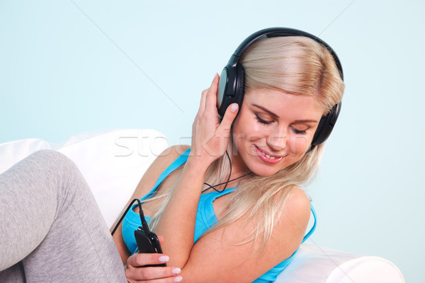 Woman listening to music Stock photo © RTimages