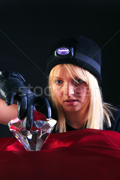 Blond woman cat burglar stealing a large diamond Stock photo © RTimages