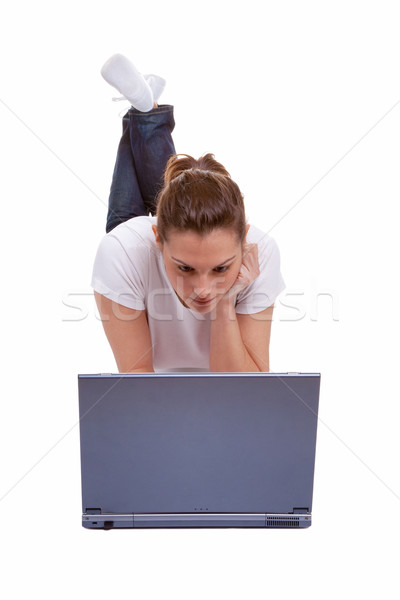 Female lying down working on a laptop Stock photo © RTimages