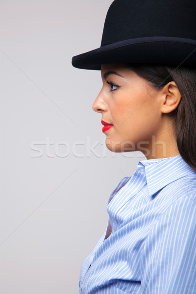 Businesswoman wearing a bowler hat. Stock photo © RTimages