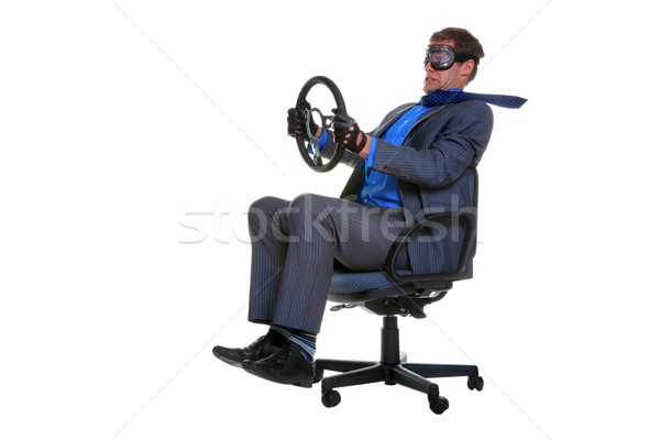 Businessman driving an office chair Stock photo © RTimages